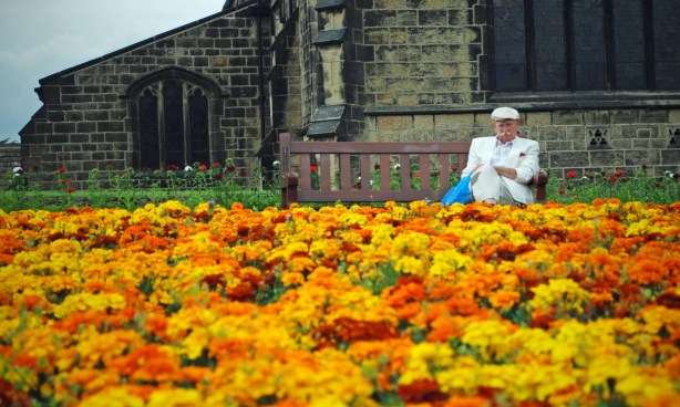 old man in front of church