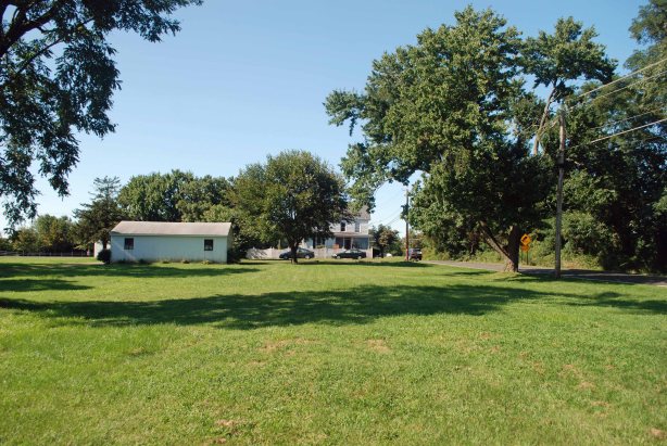 The rear of original house is in the center, the garage to the left. To the right take note of the road sign illustratiing the "weird" intersection.